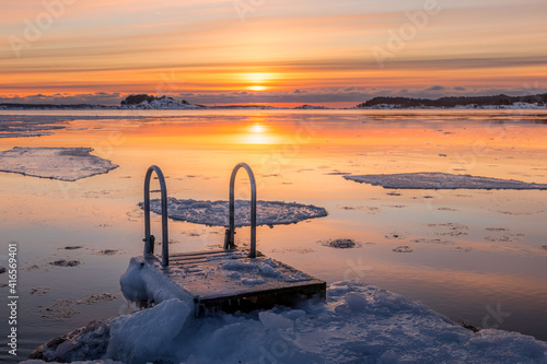 Location for ice swimming. Shot early in the morning with rising sun.