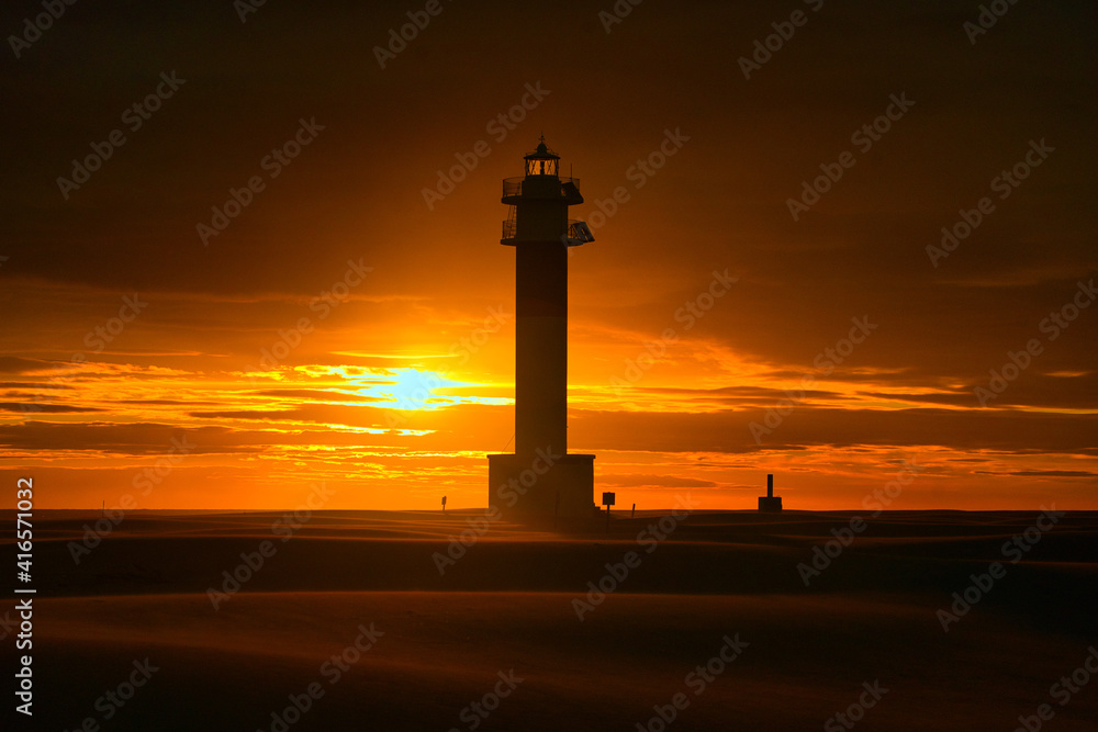 Fangar Lighthouse in Delta region of Ebre river during sunset