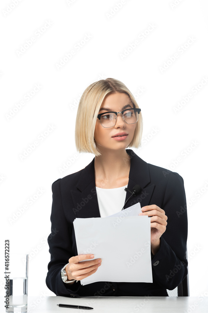 young blonde news presenter holding papers at workplace isolated on white young blonde news presenter holding papers at workplace isolated on white