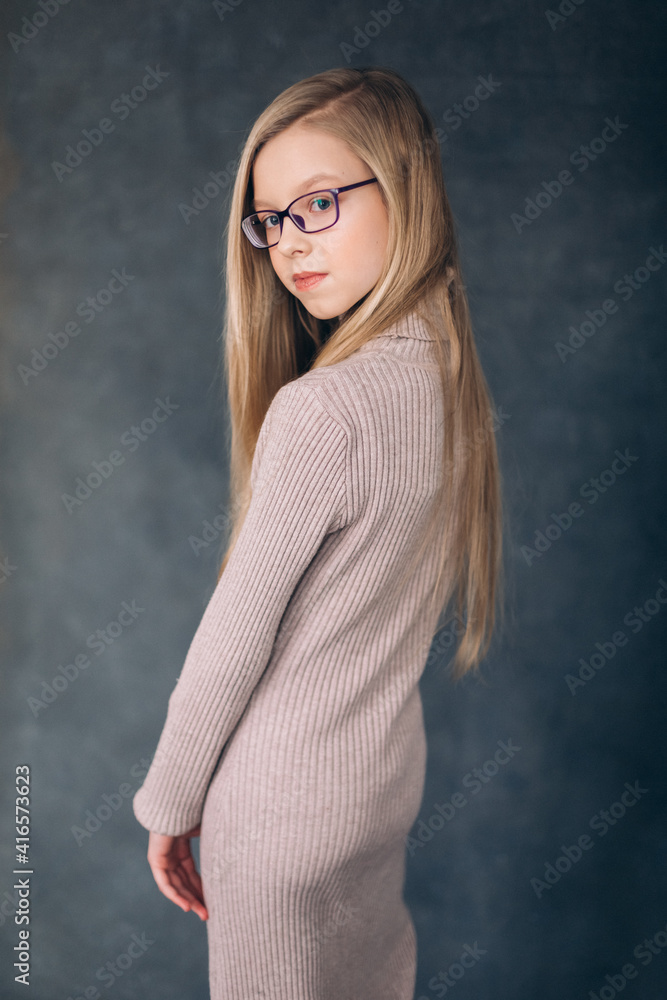 Fashion stylish caucasian girl portrait in studio with flowers Fashion stylish caucasian girl portrait in studio with flowers
