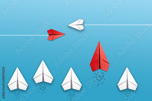 Paper plane on blue background, Business competition concept.