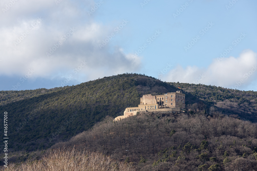 old Hambach Castle in winter from the front on a mountain with trees old Hambach Castle in winter from the front on a mountain with trees