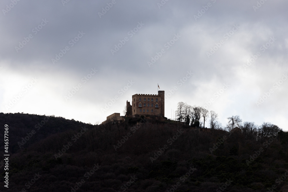 old Hambach Castle in winter from behind on a mountain with trees