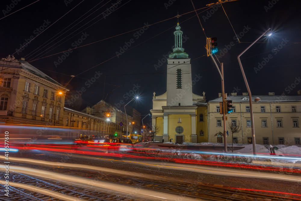 Fototapeta premium Night Lviv old city architecture in the winter season. Buildings highlighted by the illumination