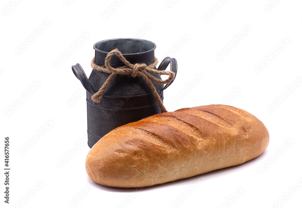 Composition of white bread and old jug on white background