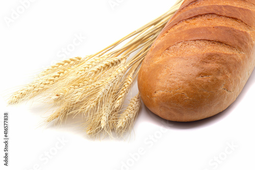 Obraz na płótnie Composition of white bread, wheat on white background w salonie