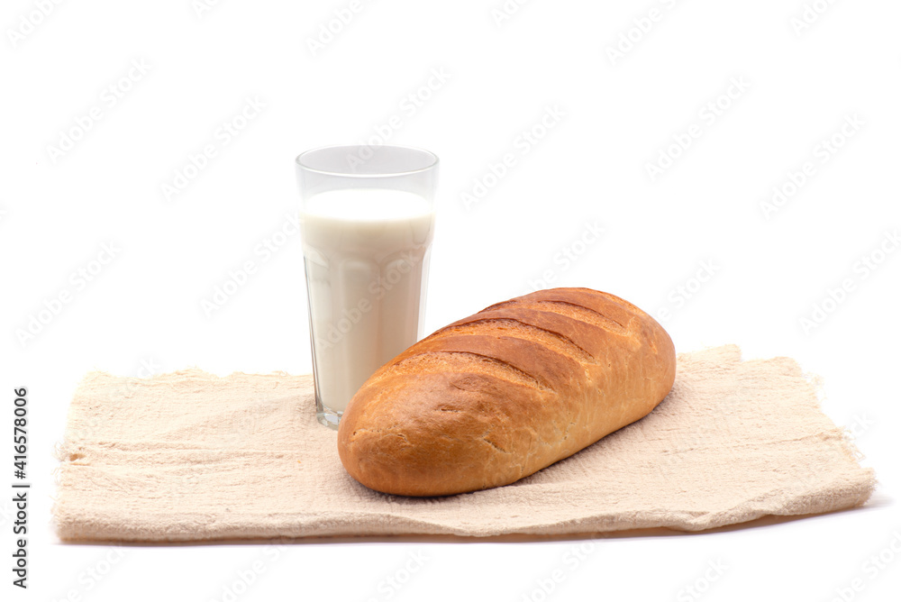 Composition of glass of milk, white bread, tablecloth on white background