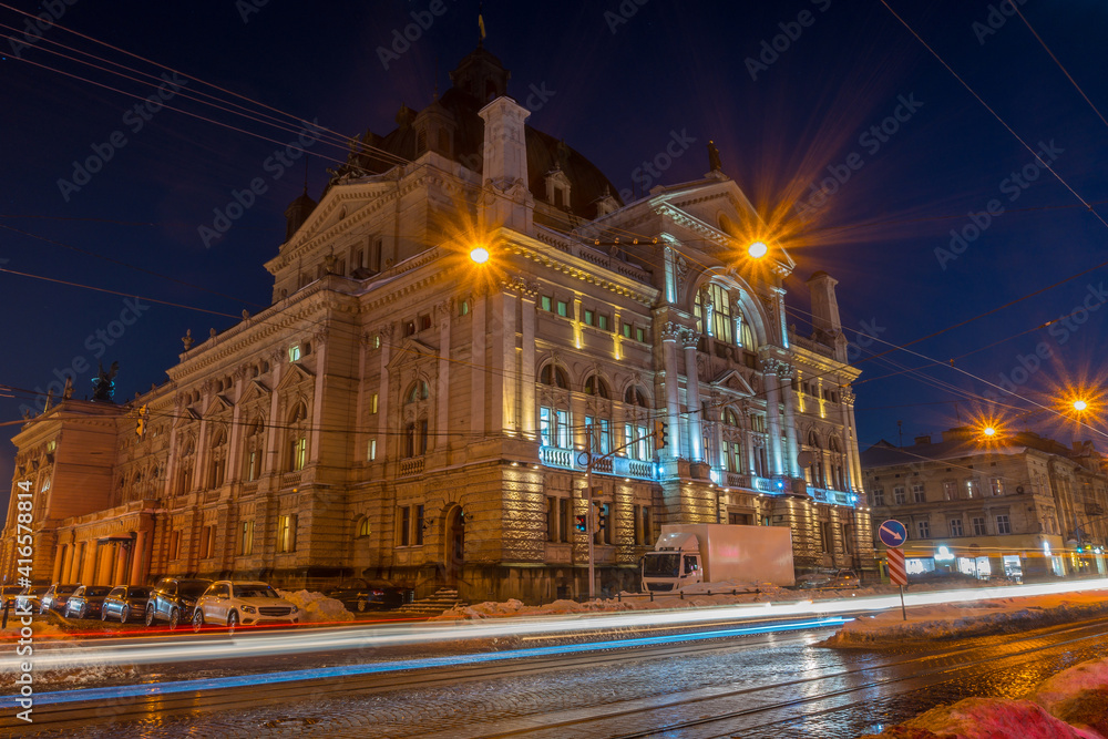 Obraz premium Night Lviv old city architecture in the winter season. Buildings highlighted by the illumination