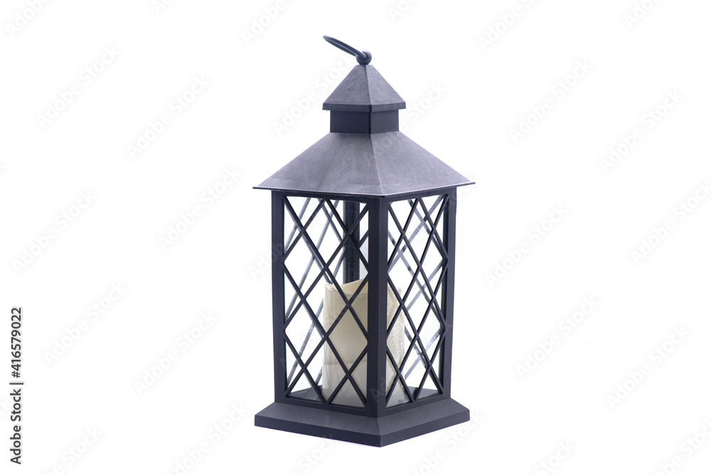 Glass lamp with a candle inside on a white background