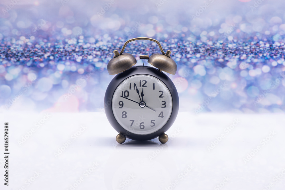 Retro alarm clock on a festive background