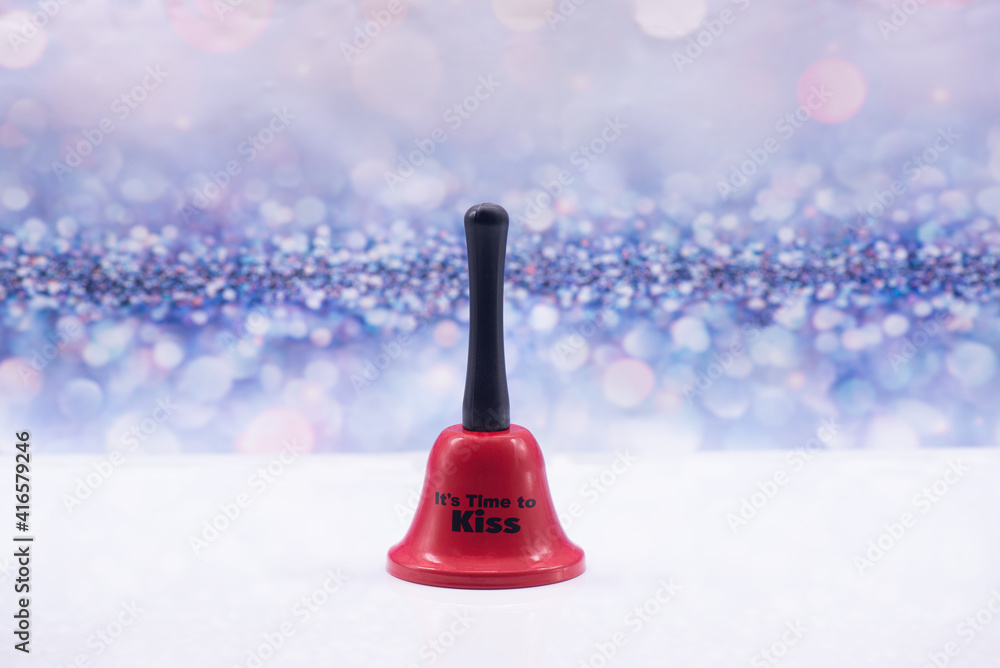 Red bell with inscription It's time to kiss on a festive background