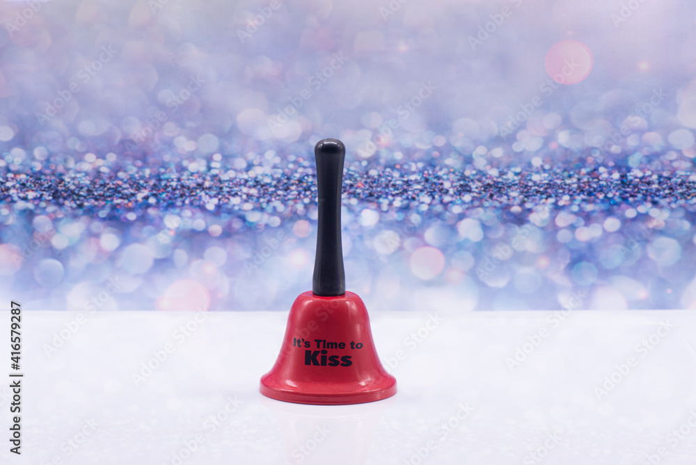Red bell with inscription It's time to kiss on a festive background