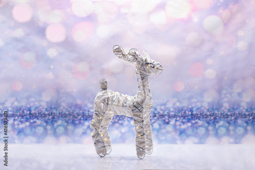 Glowing deer on a festive background. Christmas Concept