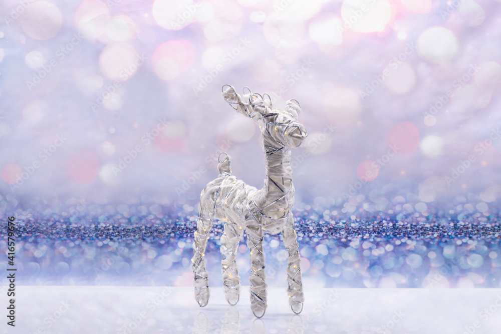 Glowing deer on a festive background. Christmas Concept