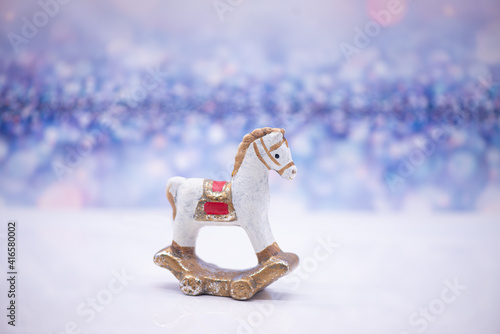 Obraz na płótnie Toy clay horse on a festive background w salonie