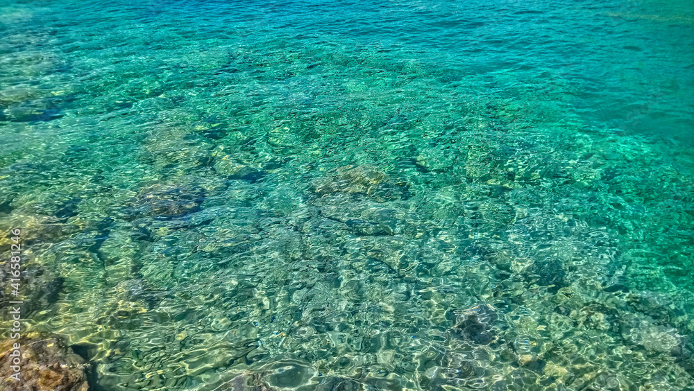 coral reef in the blue sea, turquoise water and yellow sand