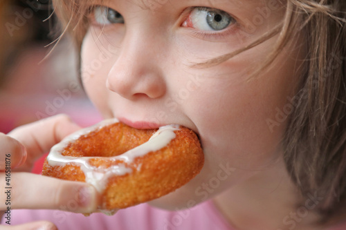 girl eating a donut