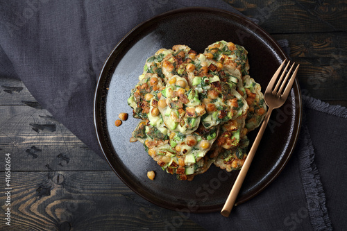 Homemade vegetable pancakes with chickpea, zucchini and mint leaves