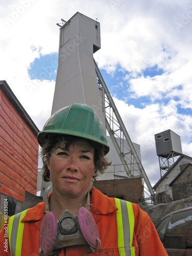 Strong woman working in an industrial setting. photo