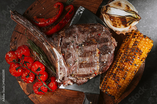 fresh grilled tomahawk steak with vegetables