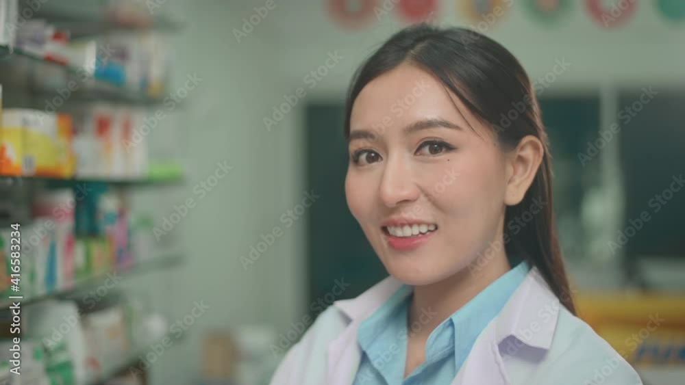 Portrait of asian woman pharmacist wearing lab coat in a modern pharmacy drugstore. Portrait of asian woman pharmacist wearing lab coat in a modern pharmacy drugstore.