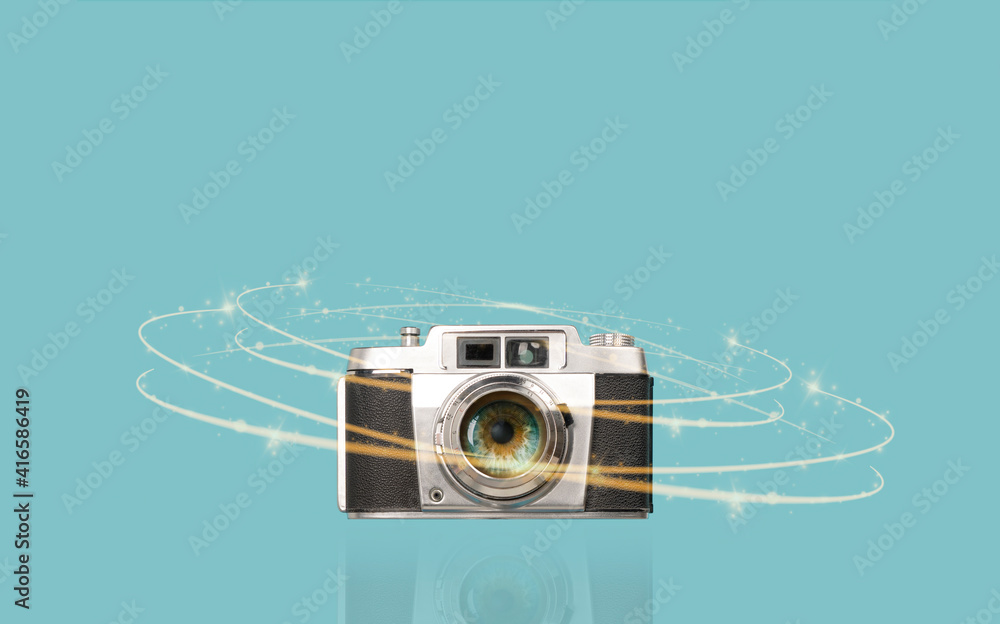 Fototapeta premium Human eye in vintage camera lens. Concept of photographic vision.