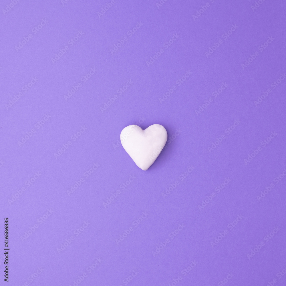 Square love concept idea with small white heart on purple background. Minimal flat lay. Square love concept idea with small white heart on purple background. Minimal flat lay.
