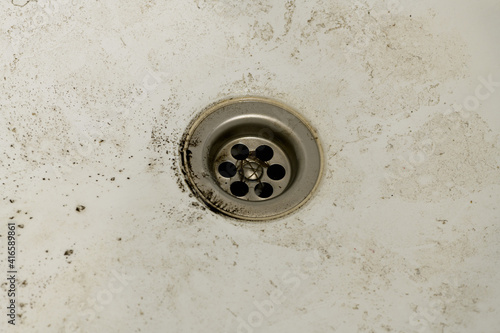 Dirty sink close-up. The concept of cleanliness and hygiene