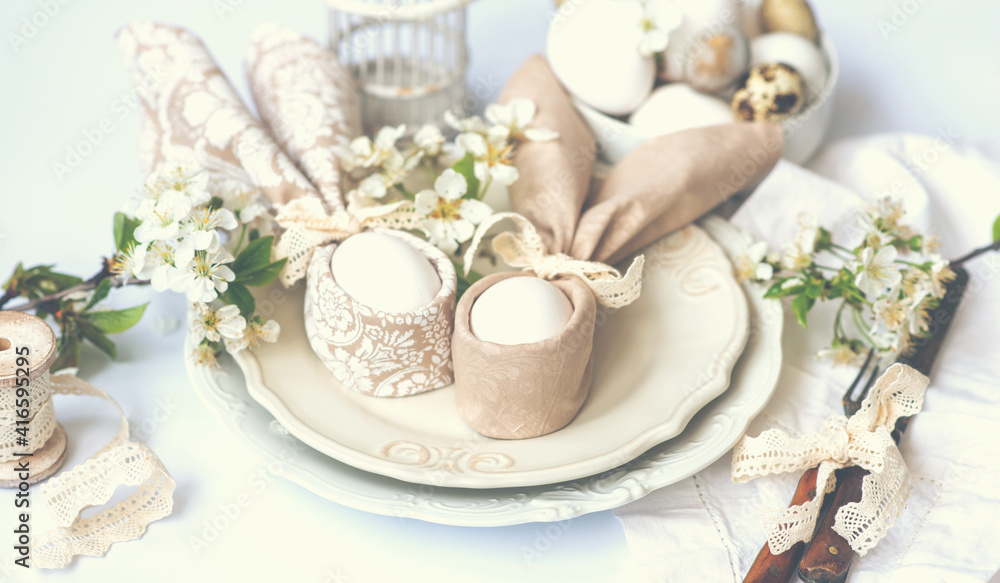 Easter background with Easter eggs and spring flowers. Easter composition with eggs on vintage white plates. Easter bunny napkin gift egg wrapping idea. Easter background with Easter eggs and spring flowers. Easter composition with eggs on vintage white plates. Easter bunny napkin gift egg wrapping idea.