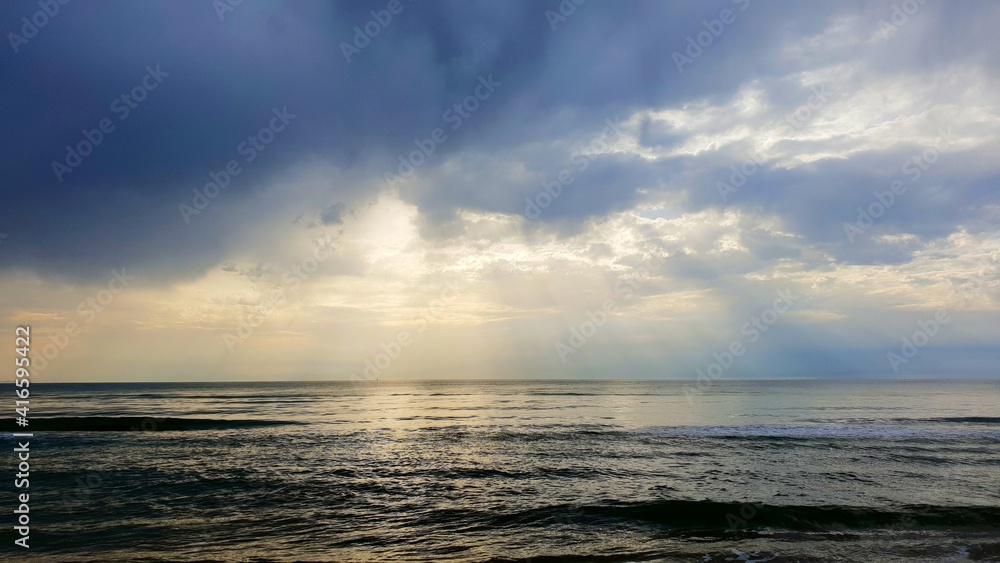 sunset over the sea, Sabudia 2021, sunset ray of sun in the sky. Wallpaper high contrast image.
