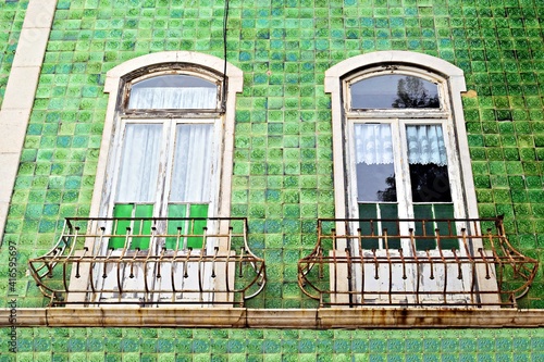 details of a traditional Portuguese house covered with green azulejos in the historic center of Lagos, a town located in the Algarve region in the Faro district, Portugal