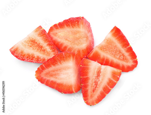 Halves of delicious fresh strawberries on white background, top view