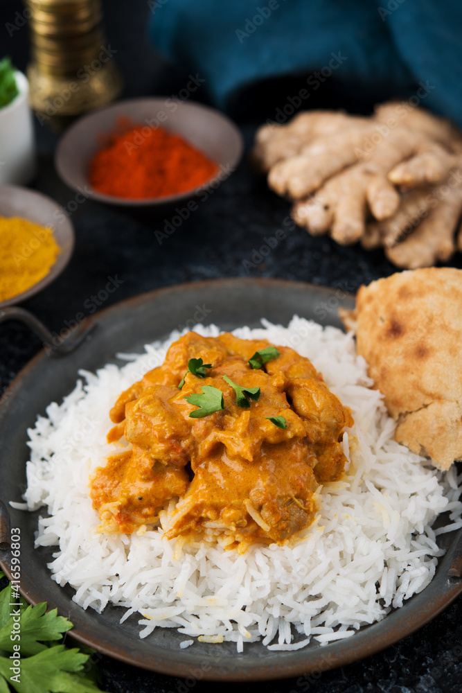 Chicken curry with rice and spices - a traditional popular Indian dish Chicken curry with rice and spices - a traditional popular Indian dish