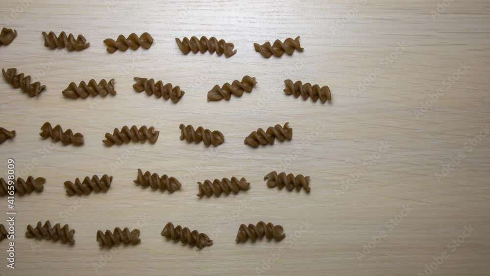 Pasta passing through - stop motion animation. Pasta went through the entire frame. Pasta going out of frame and left an empty space. Pasta passing through - stop motion animation. Pasta went through the entire frame. Pasta going out of frame and left an empty space.