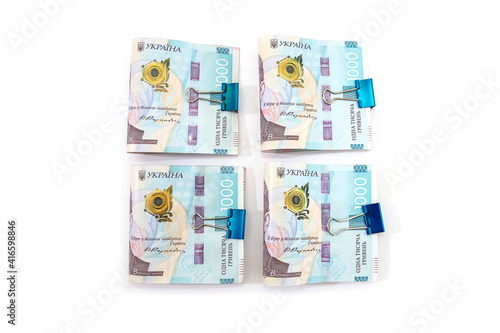 several 1000 hryvnia banknotes fastened with a clip on white. V