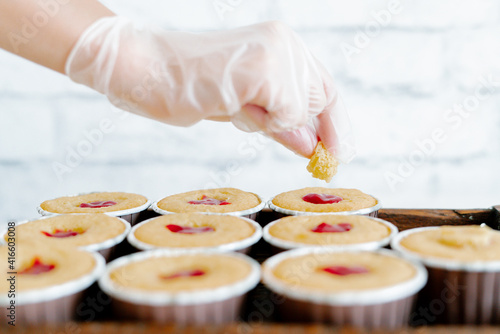 freshly baked cupcakes with strawberry berry filling on a wooden tray.Food for breakfast. Freshly baked cupcakes for dessert. Foodies and cuisine.