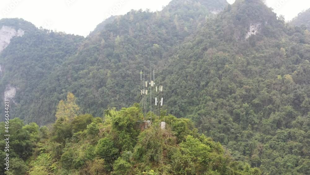 Communication base stations and antennas on a mountain top in karst terrain Communication base stations and antennas on a mountain top in karst terrain