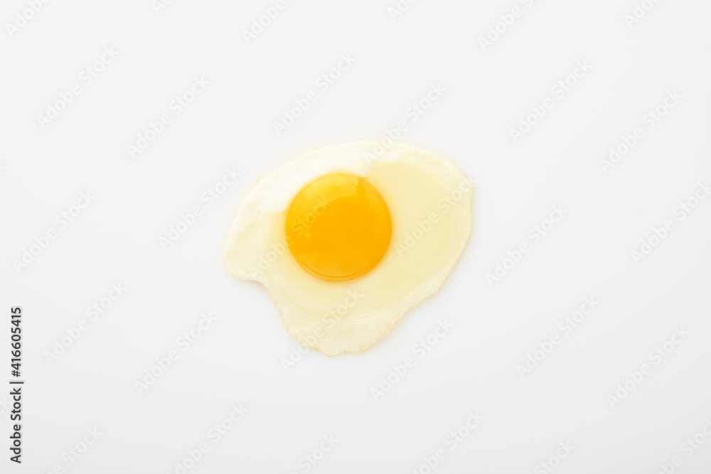 One fried egg isolated on white background with clipping path. Top view. One fried egg isolated on white background with clipping path. Top view.