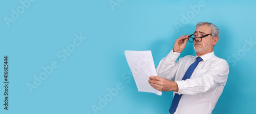 business man looking with glasses with presbyopia isolated photo