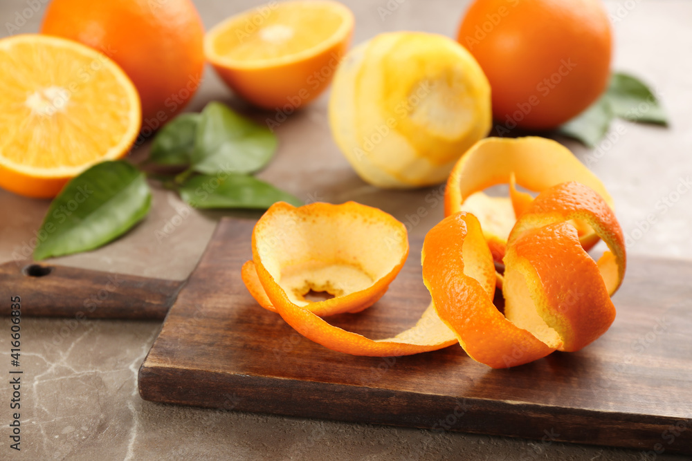 Orange fruit peel on grey marble table