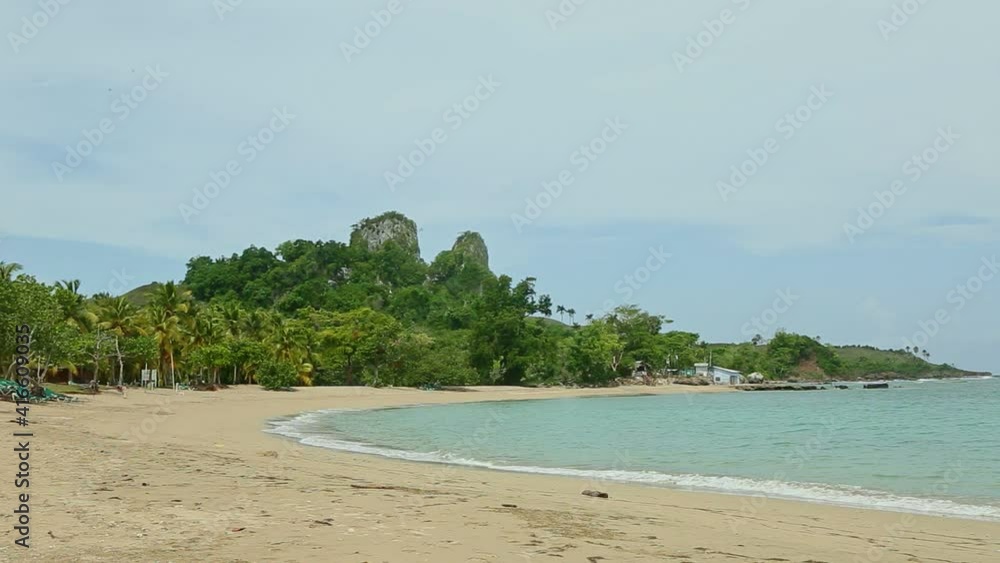 smooth zoom out from beautiful landmark of beach, green jungles, and high cliffs smooth zoom out from beautiful landmark of beach, green jungles, and high cliffs