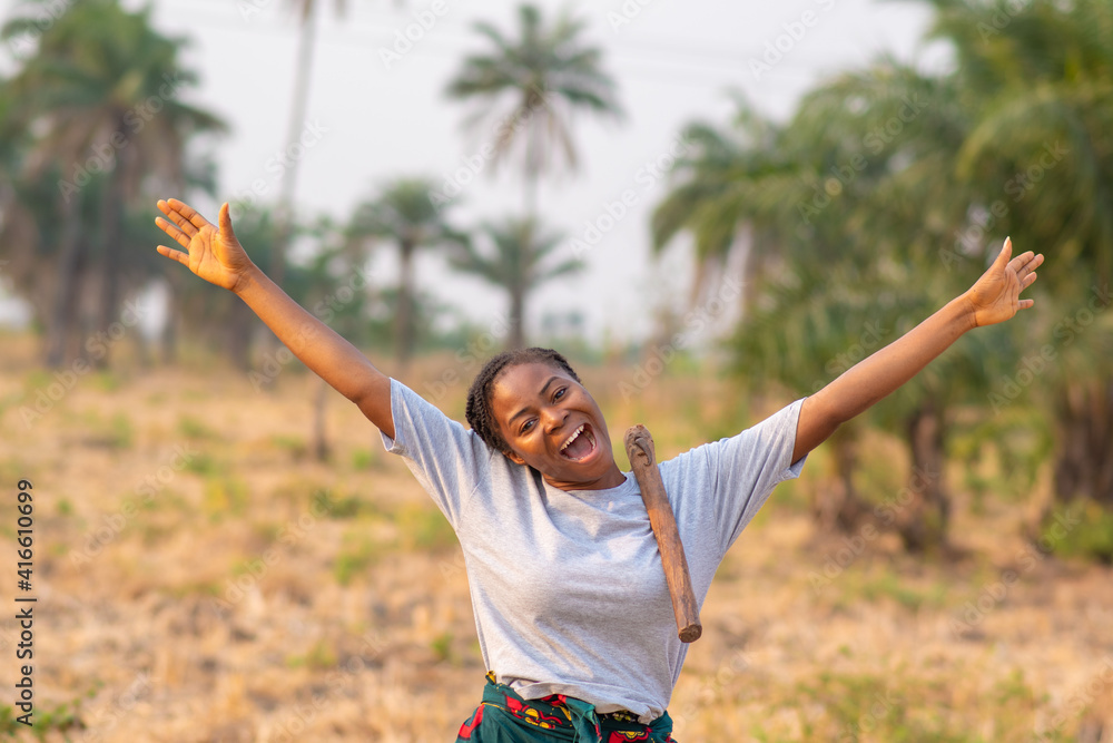 young female african farmer feeling joyful and happy