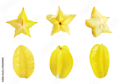 Set with delicious ripe carambola fruits on white background