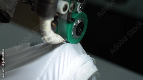 Sewing production. Machine for stitching on fabric.