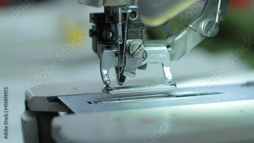 Sewing production. Machine for stitching on fabric.