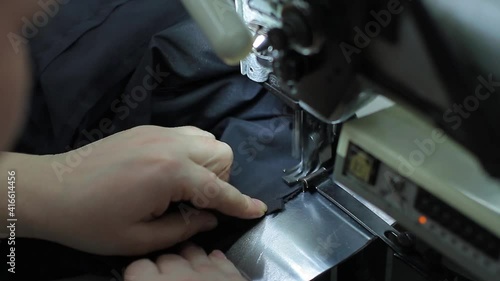 Sewing production. Machine for stitching on fabric.