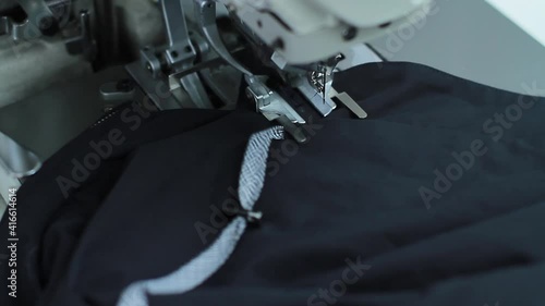 Sewing production. Machine for stitching on fabric.