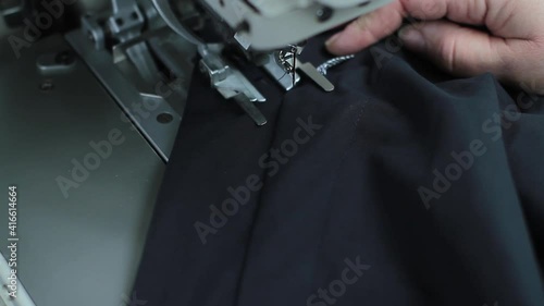 Sewing production. Machine for stitching on fabric.