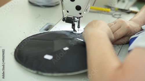 Sewing production. Machine for stitching on fabric.