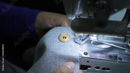 Sewing production. Machine for rivets on clothes.